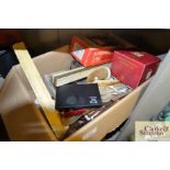 A box containing various stationery items, ivory i