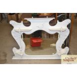 An Edwardian white painted overmantel with beveled