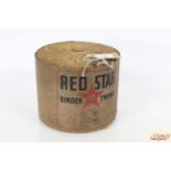 A roll of unused Red Star binder twine