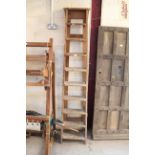 A vintage nine tread folding step ladder