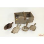 A wooden trug and contents of various butter pats,