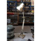 A vintage metal Angle Poise lamp on two step base