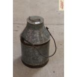 A metal ware milk churn of tapering form with swi