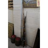A bundle of fishing rods and various reels