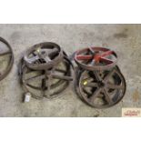 Two pairs of cast iron wheels and two odd wheels