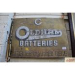 A tin advertising sign for "Oldham's Batteries - B