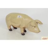 A butchers wooden display pig, measuring approximately 18 inches in length X 8 1/2 inches measured
