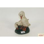 A cast iron duck decorated door stop