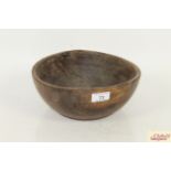 A small rustic wooden bowl
