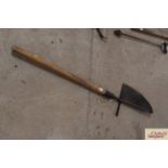 A long handled peat cutting tool