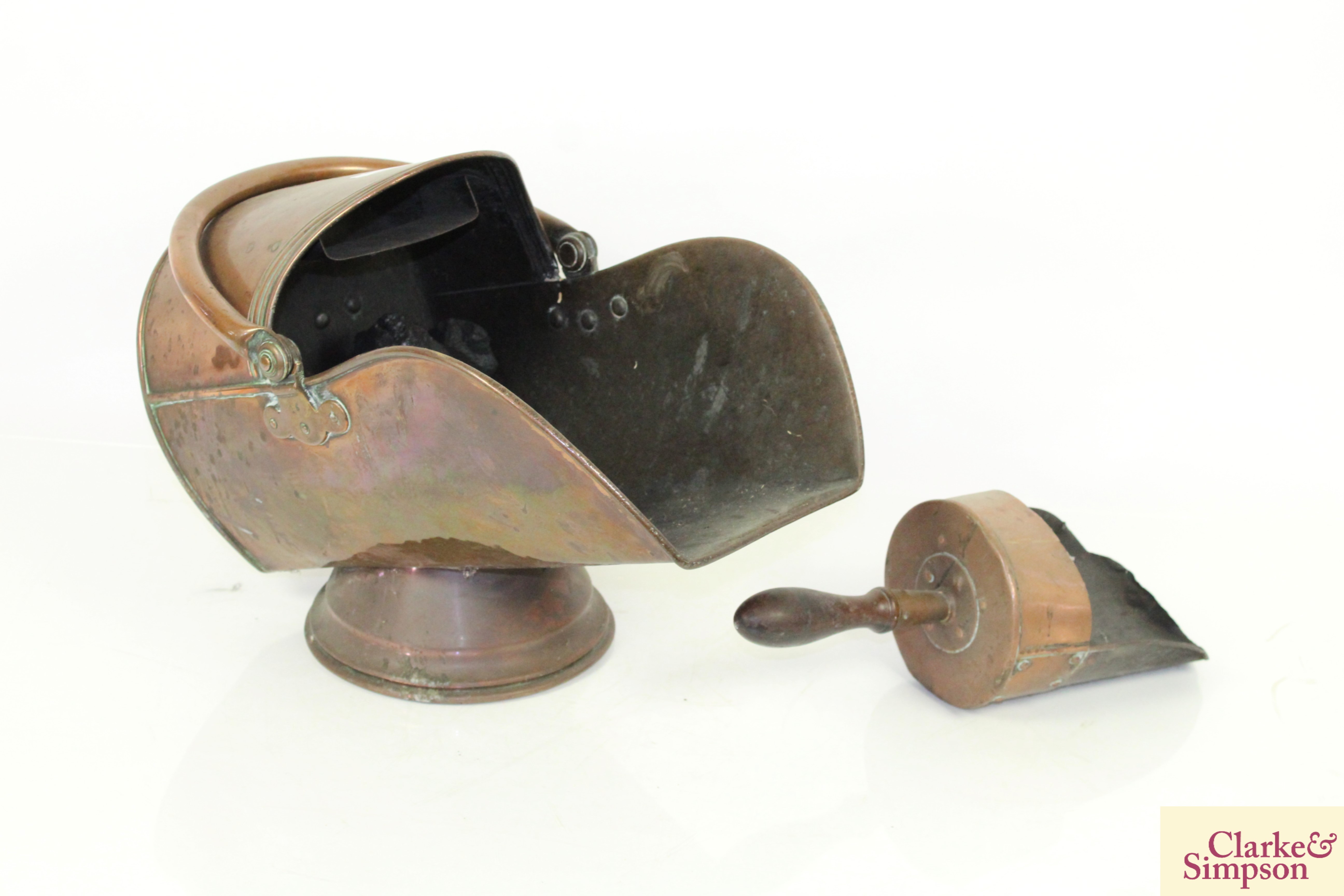 An antique copper coal scuttle and scoop with turn