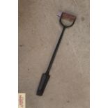 A cast iron drainage spade