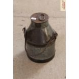 A small metal ware milk churn with swing handle i