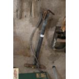 A vintage stirrup pump