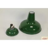 A large green enamel lampshade and a smaller simil