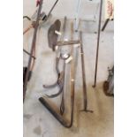A quantity of long handled tools, hay knife, dibbe