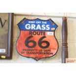 A shield shaped sign "Keep Off The Grass Route 66