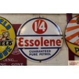 An "Essolene Guaranteed Pure Petrol" enamel advert