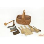 A wicker basket containing various vintage kitchen