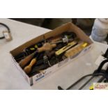 A box containing various drill bits, small tools,