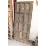 An old oak panelled door, approx. 77" x 32¾"