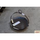 An iron hanging frying pan with pourer