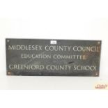 A bronze sign for "Middlesex County Council Educat