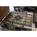 Three antique leaded coloured glass window pan