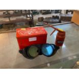 A pair of BOCAL welding goggles and a WESCO oil can