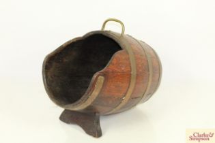 A wooden and brass coopered coal scuttle