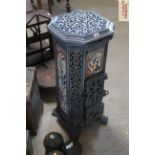 An Art Nouveau style cast iron and enamel multifuel stove inscribed "Godin"