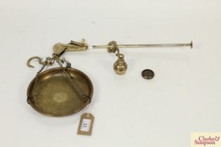 A small brass steelyard and weights