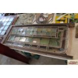 Two antique leaded coloured glass window panels