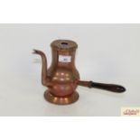 An antique copper side pouring chocolate pot