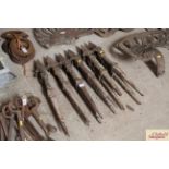 Twelve antique cast iron border stakes