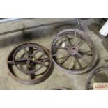 A pair of cast iron wheels and two others