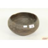 A small rustic wooden bowl