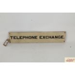 A telephone exchange sign, approx. 20" long