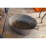 A vintage galvanised twin handled bath