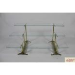 A set of good quality triple layer, height adjustable, late Victorian brass and glass shop window