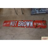 A "We Sell Nut Brown Tobacco" enamel advertising s