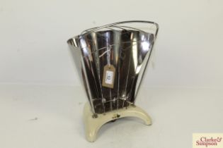 A vintage enamel and metalware heater