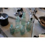 Seven various vintage glass bottles including exam