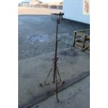 A wrought iron and brass mounted telescopic oil la