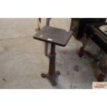 A small claw foot pedestal adjustable stand