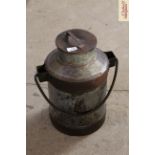 A metal ware milk churn with swing handle