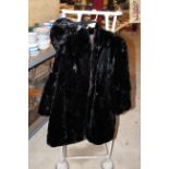 A vintage fur coat and hand warmer