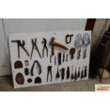 A display board of cobblers tools, shoe stretchers