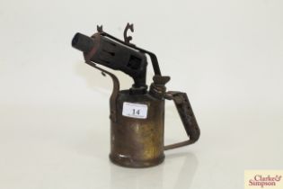 A vintage brass blow lamp