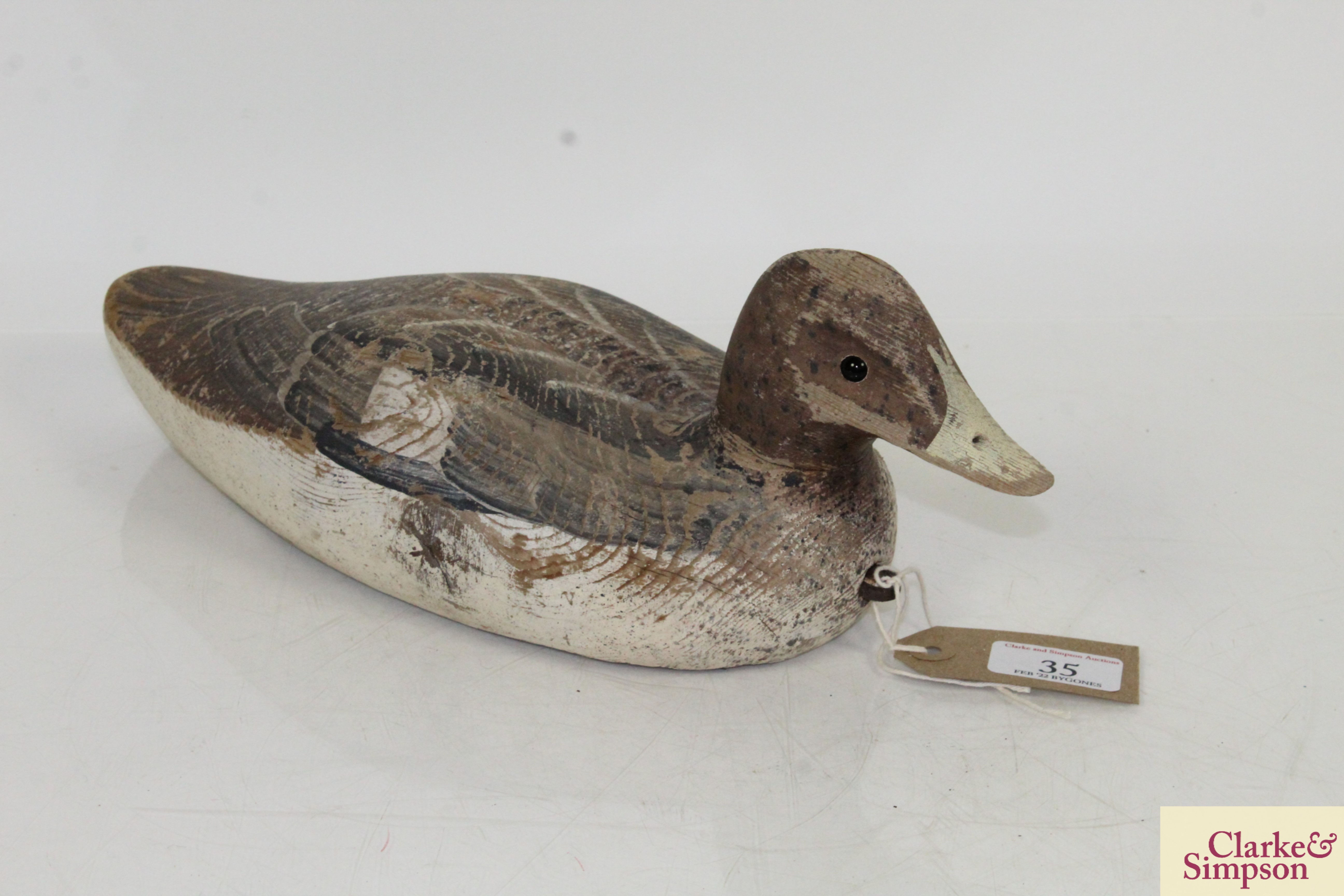 A vintage painted wooden decoy duck, approx. 13½" long